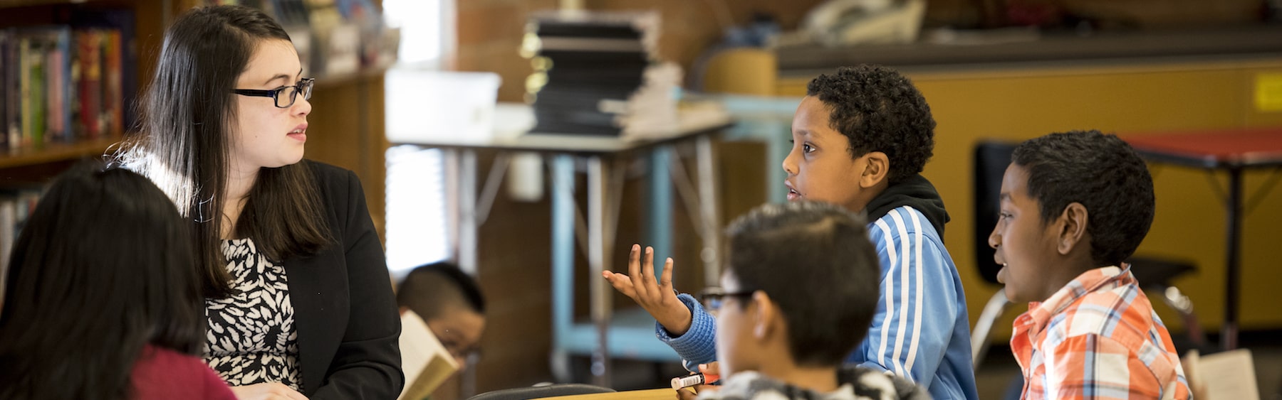 Elementary teacher speaking with students