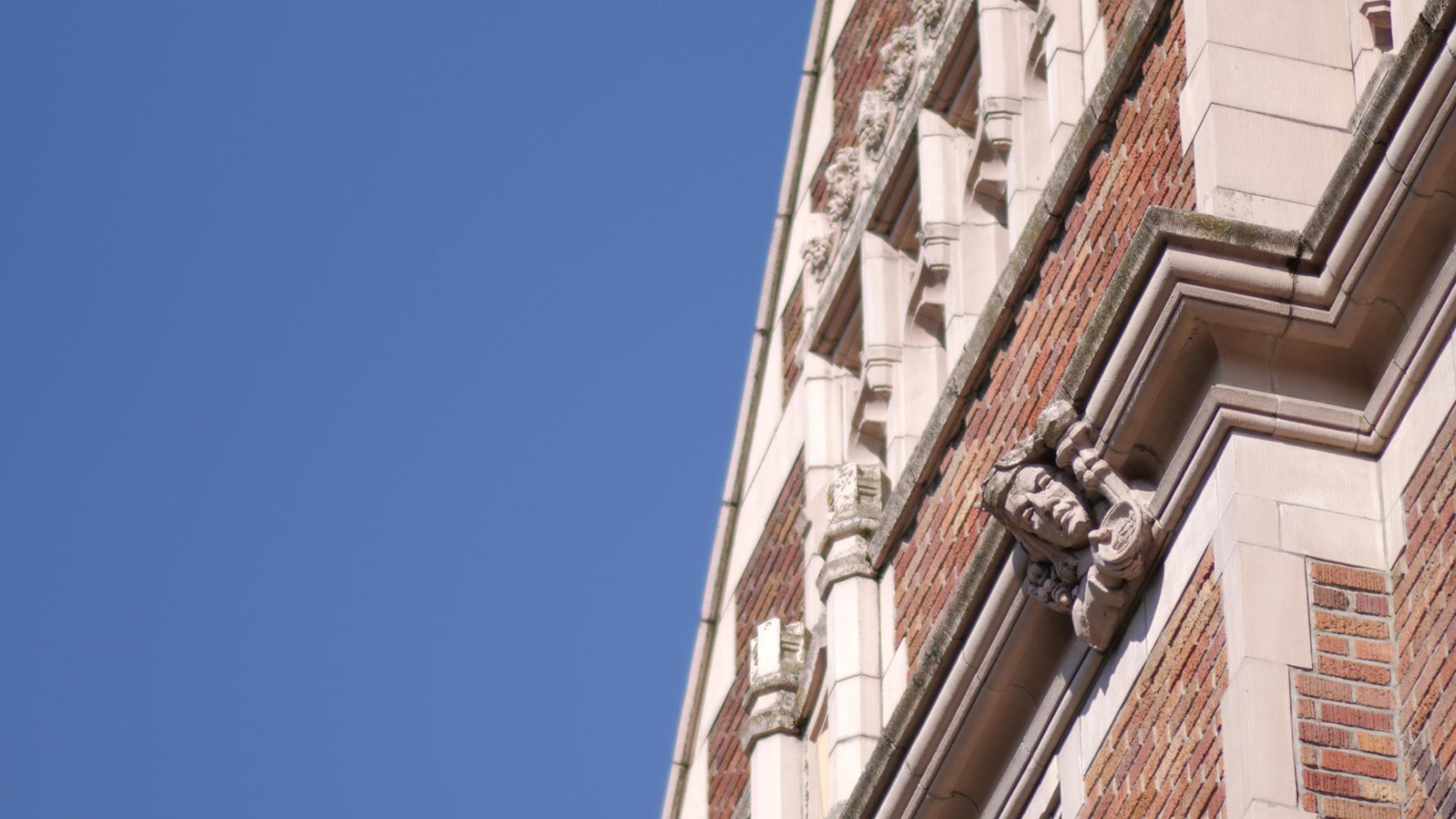 The exterior of Miller Hall with ornately carved sculptures along the roof