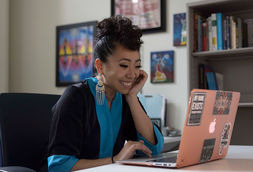 Doctoral candidate and Banks Center graduate assistant Doua Kha photographed&nbsp;in the center.