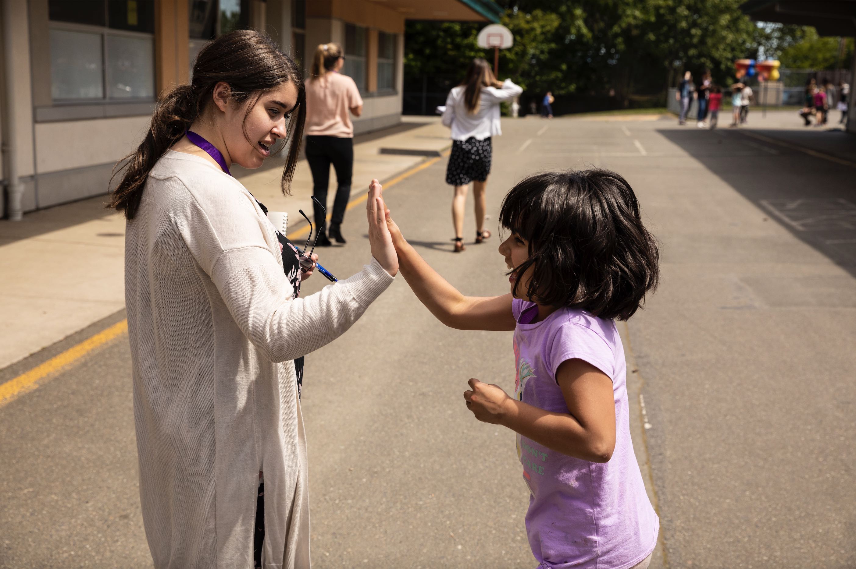 Teacher high-fiving a student