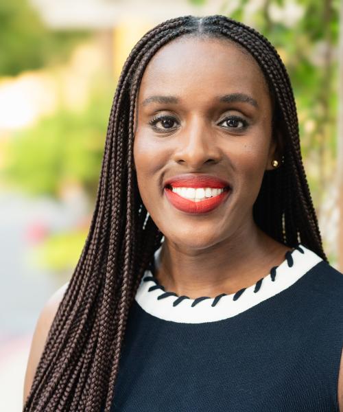 Headshot of Lakeya Afolalu, smiling.