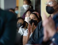 students attending a symposium